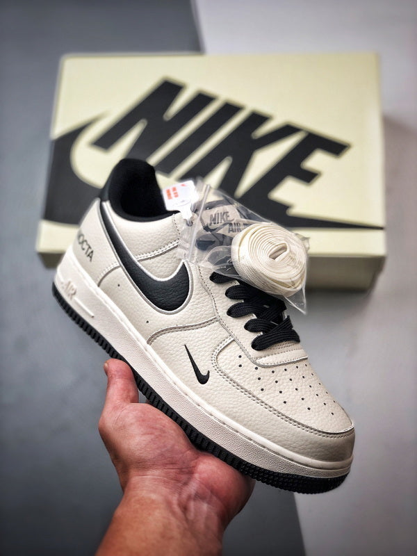 NOCTA x Air Force 1 Low Creme e Preto